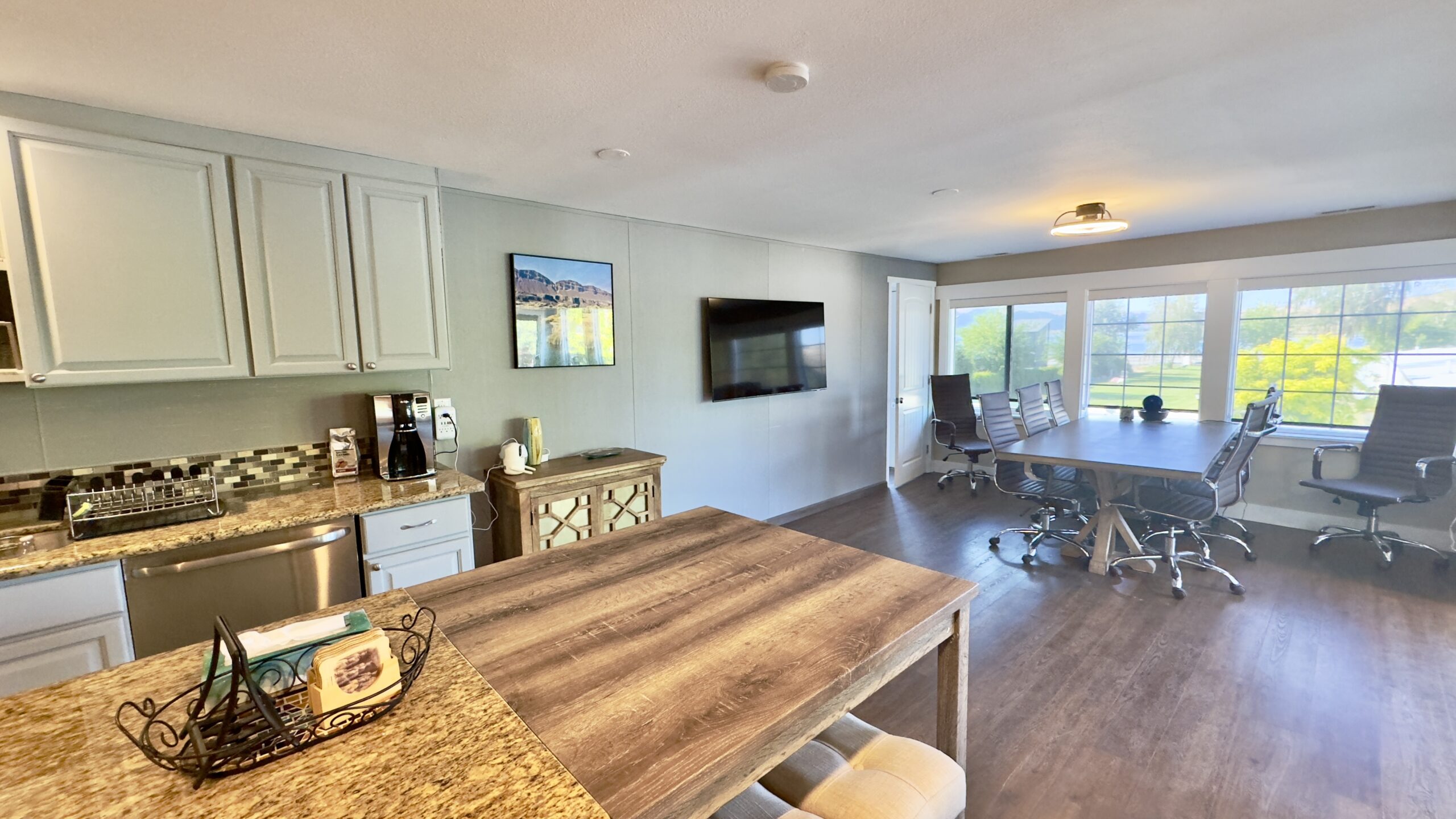 Suite 32 kitchen and conference room split view at Soap Lake Resort