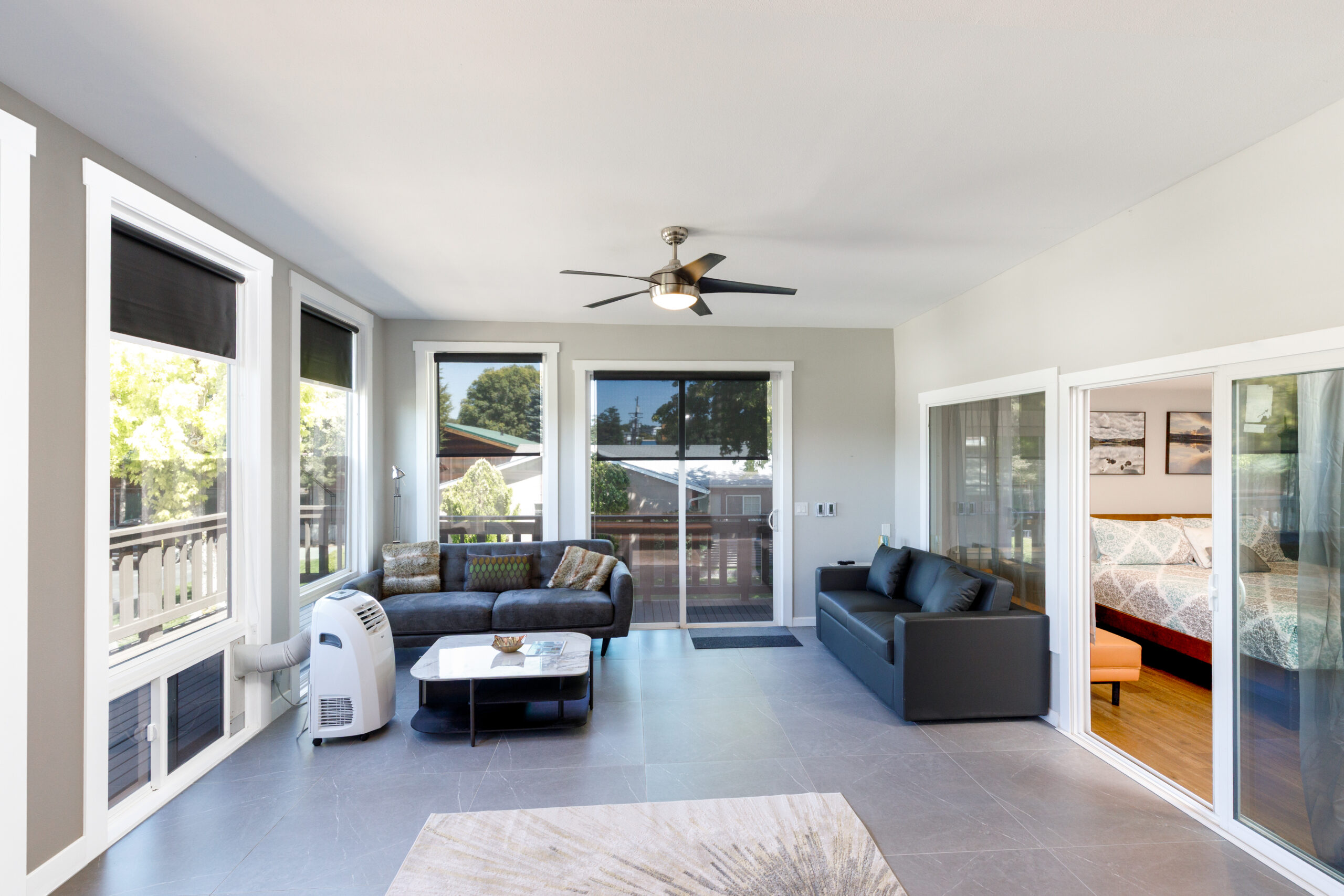 Spacious open-plan living room with large windows and deck view at Soap Lake Resort